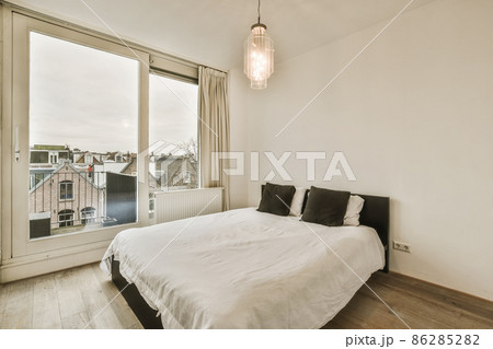 Beautiful bedroom in new luxury home with some decor 86285282