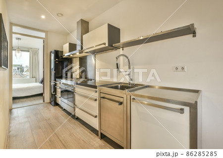 Cozy well designed modern kitchen interior with all appliances 86285285