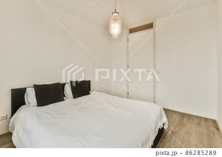 Beautiful bedroom in new luxury home with some decor 86285289