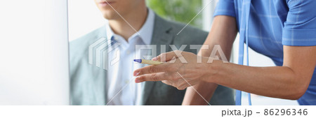 Young man communicates with colleague and is studying business strategies on computer closeup Young man communicates with colleague and is studying business strategies on computer closeup 86296346