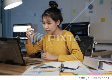 Picture of angry overworked young woman in home office. Picture of angry overworked young woman in home office. 86297773