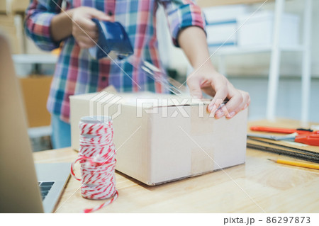 Online business owner preparing product to customer. 86297873
