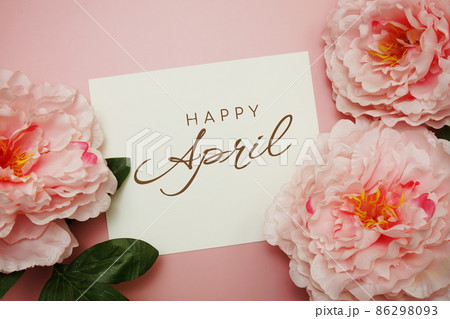 Happy April typography text with flowers on pink background Happy April typography text with flowers on pink background 86298093