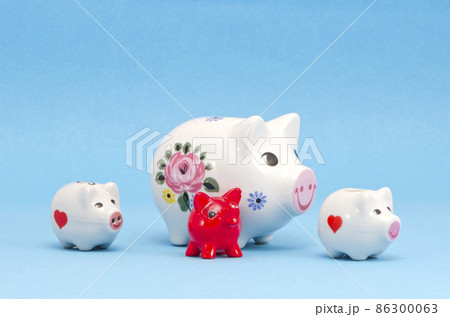 various piggy-banks on azure background various piggy-banks on azure background 86300063