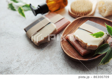 Handmade soap bars and green leaves Handmade soap bars and green leaves 86300709