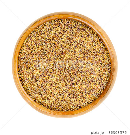 Red clover seeds, in a wooden bowl. Trifolium pratense, plant in bean family Fabaceae, with trifoliate leaves and pink flowers. Seeds for growing microgreens or as a fodder crop for nitrogen fixation. Red clover seeds, in a wooden bowl. Trifolium pratense, plant in bean family Fabaceae, with trifoliate leaves and pink flowers. Seeds for growing microgreens or as a fodder crop for nitrogen fixation. 86303576