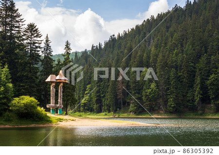 landscape with lake. green nature in summer. forest reflection in the water. beautiful travel view of synevyr national park, ukraine. tranquil outdoor environment 86305392