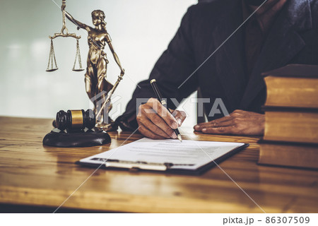Attorneys sign legal contract documents. while sitting in a private office. Attorneys sign legal contract documents. while sitting in a private office. 86307509