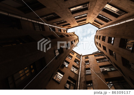 Dark inner courtyard perspective, old houses, St.Petersburg Dark inner courtyard perspective, old houses, St.Petersburg 86309137
