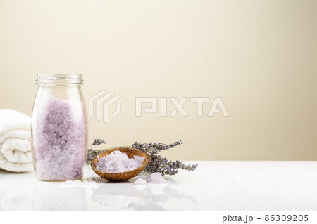 Lavender bath salt in a glass jar with flowers 86309205