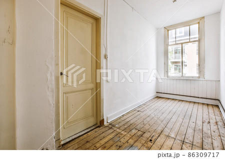 An exciting design of a room with large windows and a door An exciting design of a room with large windows and a door 86309717