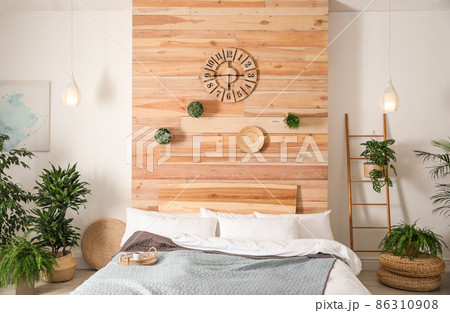 Stylish bedroom interior with green plants. Home design ideas 86310908