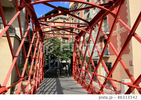 Eiffel Bridge through the river Onyar in Girona, Catalonia, Spainon on the summer sunny day. 86313542