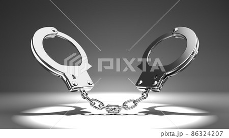 Handcuffs on gray background. Handcuffs on gray background. 86324207
