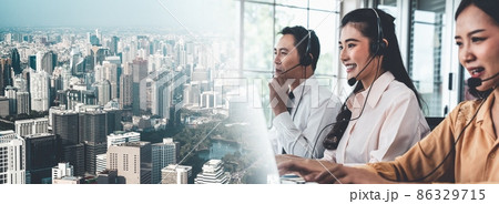 Business team wearing headset working actively in office Business team wearing headset working actively in office 86329715
