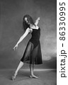 Modern style dancer posing on grey background 86330995