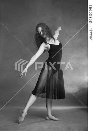 Modern style dancer posing on grey background 86330995