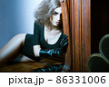 Fashion shot of beautiful woman laying on floor 86331006