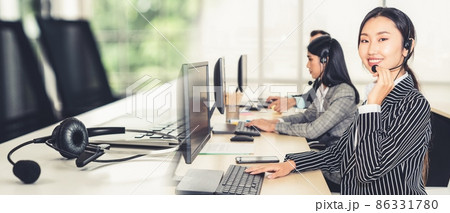 Business people wearing headset working in office broaden view 86331780