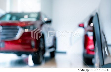 Blur new red car parked in luxury showroom. Car dealership office. New car parked in modern showroom for sale and rental service. Automobile leasing agent and car dealer center concept. EV market. Blur new red car parked in luxury showroom. Car dealership office. New car parked in modern showroom for sale and rental service. Automobile leasing agent and car dealer center concept. EV market. 86332051