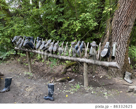 Rubber boots in the woods 86332625