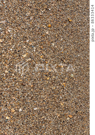 Sand on the beach for background. Brown beach sand texture as background. Sand on the beach for background. Brown beach sand texture as background. 86333414