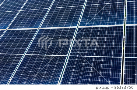 solar panels installed on the ground produce environmentally friendly energy in summer solar panels installed on the ground produce environmentally friendly energy in summer 86333750