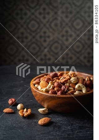 Mixed nuts in a bowl Mixed nuts in a bowl 86334105