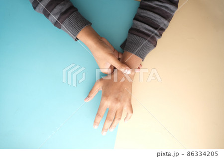 man suffering pain in hand top view  86334205
