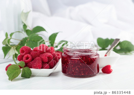 Jar of raspberry jam and fresh berries. Jar of raspberry jam and fresh berries. 86335448