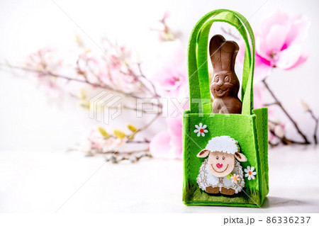 Easter greeting card with chocolate sweets rabbit 86336237