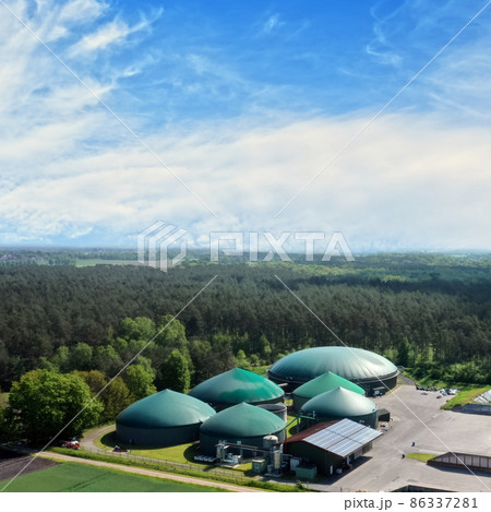 Aerial view of a biogas plant for the production of methane for the generation of electric power near Wesendorf, Germany 86337281