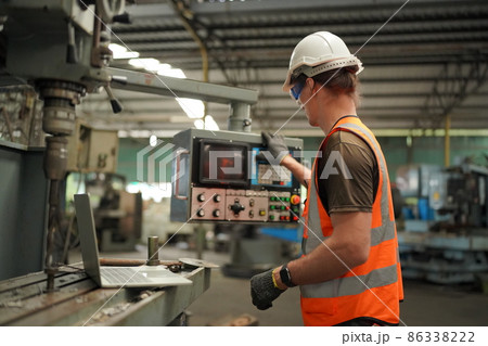 Industry engineer worker operate control heavy machine in factory. 86338222