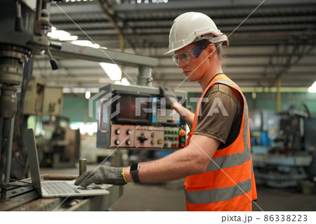 Industry engineer worker operate control heavy machine in factory. 86338223