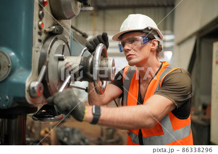 Industry engineer worker operate control heavy machine in factory. 86338296