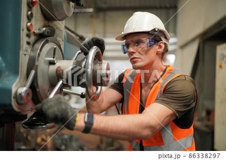 Industry engineer worker operate control heavy machine in factory. 86338297