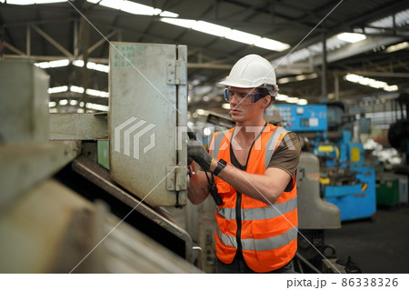 Industry engineer worker operate control heavy machine in factory. Industry engineer worker operate control heavy machine in factory. 86338326