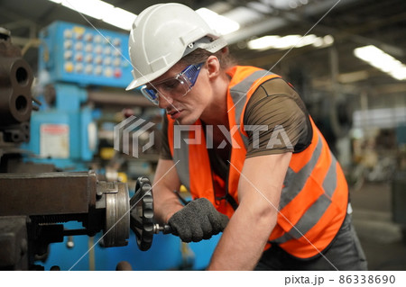 Industry engineer worker operate control heavy machine in factory. Industry engineer worker operate control heavy machine in factory. 86338690