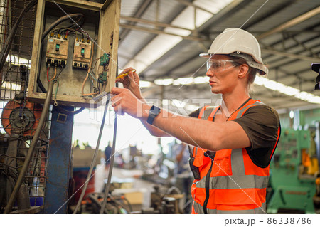 Industry engineer worker operate control heavy machine in factory. Industry engineer worker operate control heavy machine in factory. 86338786