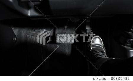 Accelerate and Brake. Foot pressing foot pedal of a car to drive ahead. Accelerator and brake pedal in a car. Driver driving the car by pushing accelerator pedals of the car. inside vehicle automobile Accelerate and Brake. Foot pressing foot pedal of a car to drive ahead. Accelerator and brake pedal in a car. Driver driving the car by pushing accelerator pedals of the car. inside vehicle automobile 86339485