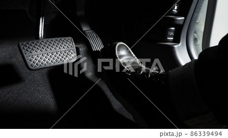 Accelerate and Brake. Foot pressing foot pedal of a car to drive ahead. Accelerator and brake pedal in a car. Driver driving the car by pushing accelerator pedals of the car. inside vehicle automobile Accelerate and Brake. Foot pressing foot pedal of a car to drive ahead. Accelerator and brake pedal in a car. Driver driving the car by pushing accelerator pedals of the car. inside vehicle automobile 86339494