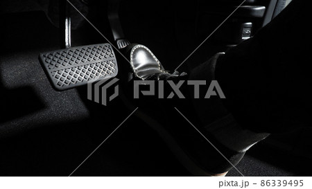 Accelerate and Brake. Foot pressing foot pedal of a car to drive ahead. Accelerator and brake pedal in a car. Driver driving the car by pushing accelerator pedals of the car. inside vehicle automobile Accelerate and Brake. Foot pressing foot pedal of a car to drive ahead. Accelerator and brake pedal in a car. Driver driving the car by pushing accelerator pedals of the car. inside vehicle automobile 86339495