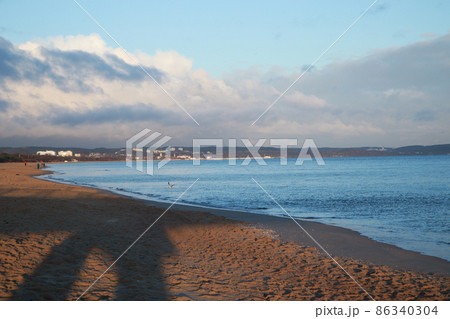 Dawn on the Baltic Sea sand water waves. Sea in Gdansk, Poland	 86340304