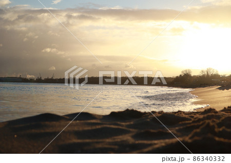 Dawn on the Baltic Sea sand water waves. Sea in Gdansk, Poland Dawn on the Baltic Sea sand water waves. Sea in Gdansk, Poland 86340332