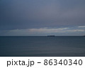 Open sea. Ship boat in the middle of the sea. Cloudy cloudy weather. Water waves. Sun at sea. 86340340