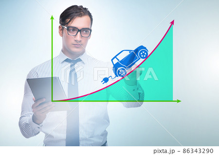 Electric car concept with businessman pressing button Electric car concept with businessman pressing button 86343290