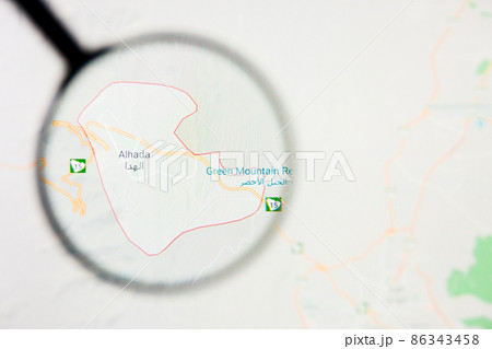 Al Hada city in Saudi Arabia visualization illustrative concept on display screen through magnifying glass 86343458