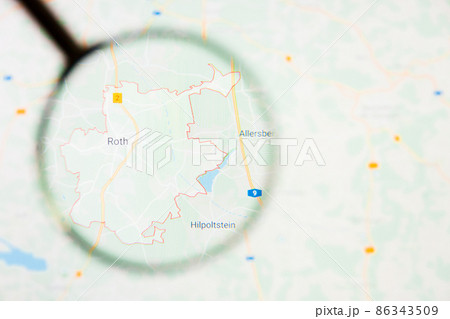 Roth city in Germany, Bavaria visualization illustrative concept on display screen through magnifying glass 86343509