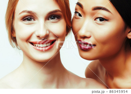 different nation woman: caucasian and asian together isolated on white background happy smiling, diverse type on skin, lifestyle people concept 86345954