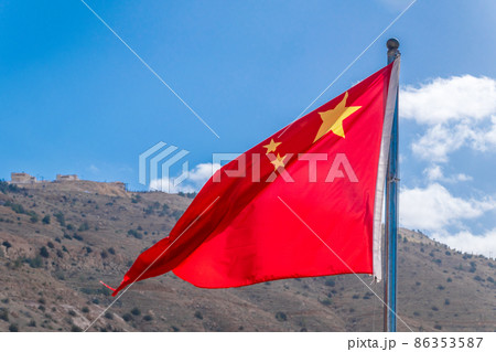 Flag of China also known as the Five-starred Red Flag waving in the wind. Flag of China also known as the Five-starred Red Flag waving in the wind. 86353587
